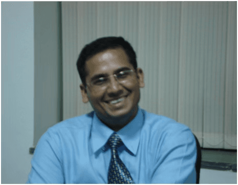 Dr Ajay Rana receiving an award for excellence in education