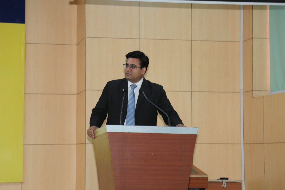 Dr Ajay Rana delivering a keynote address at the podium